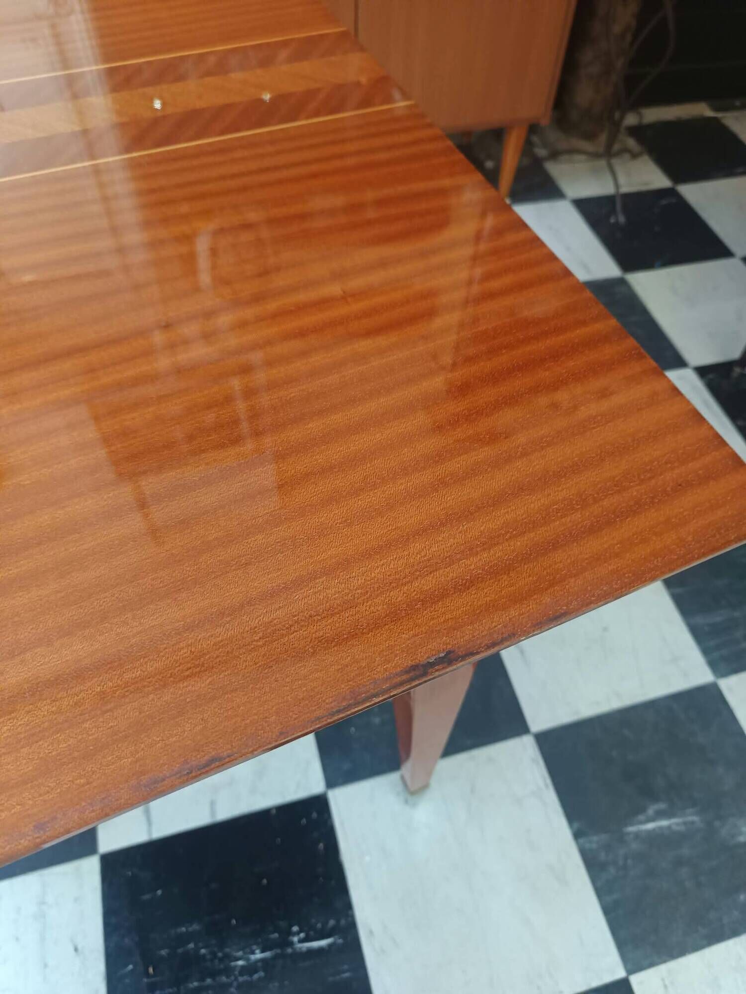 Mid-century vintage coffee table with tapered legs.