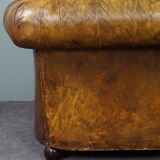 Patinated Chesterfield armchair
