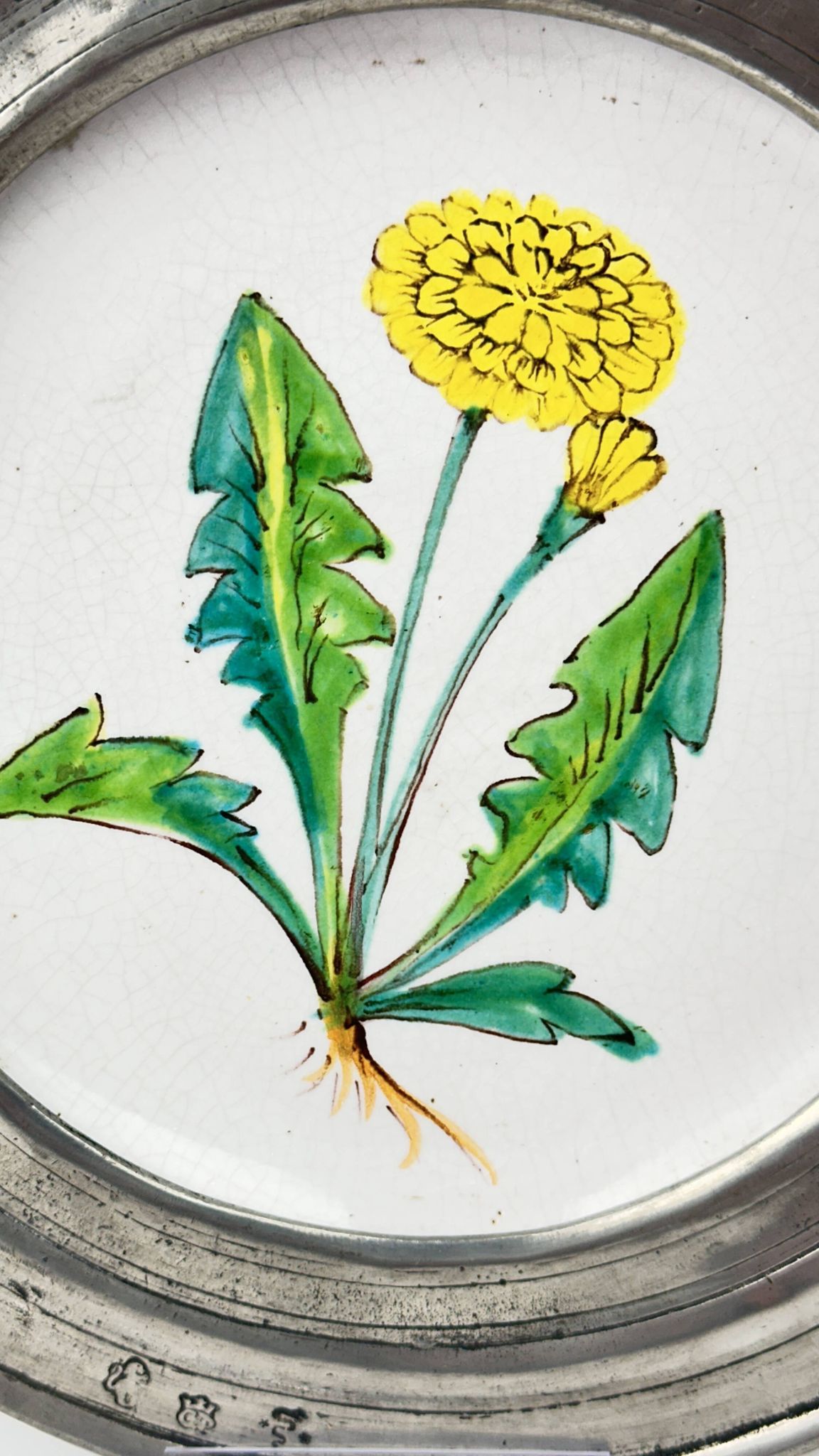 Decorative wall plate in earthenware and pewter with dandelion