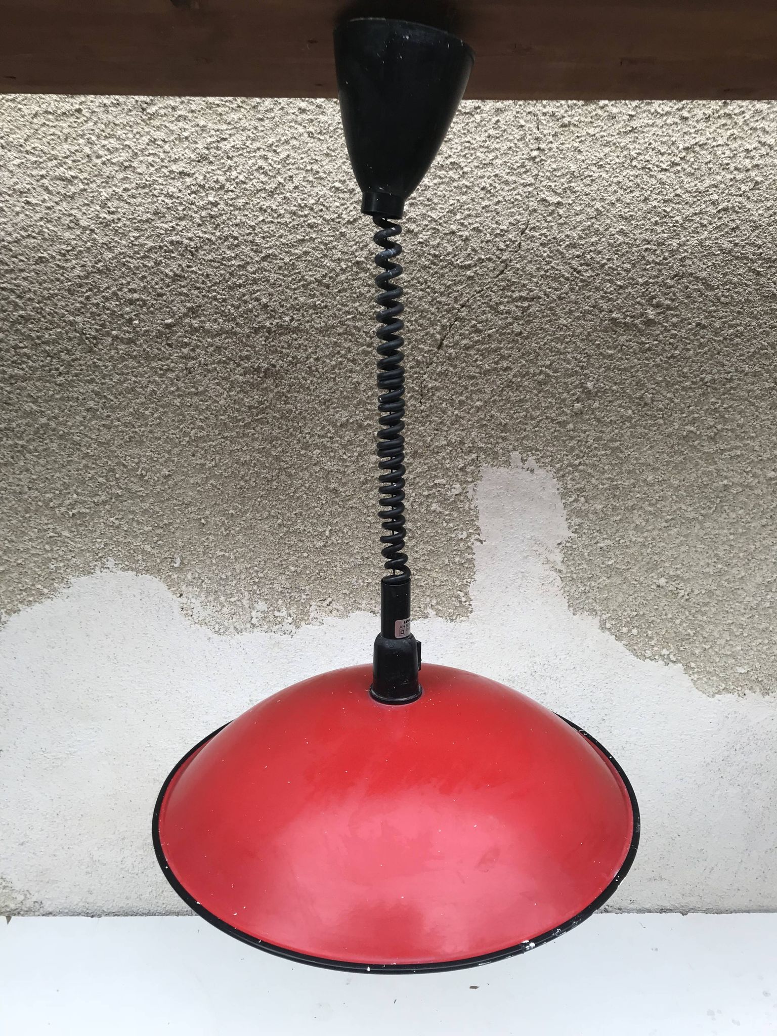 Old red metal suspension lamp from the 70s