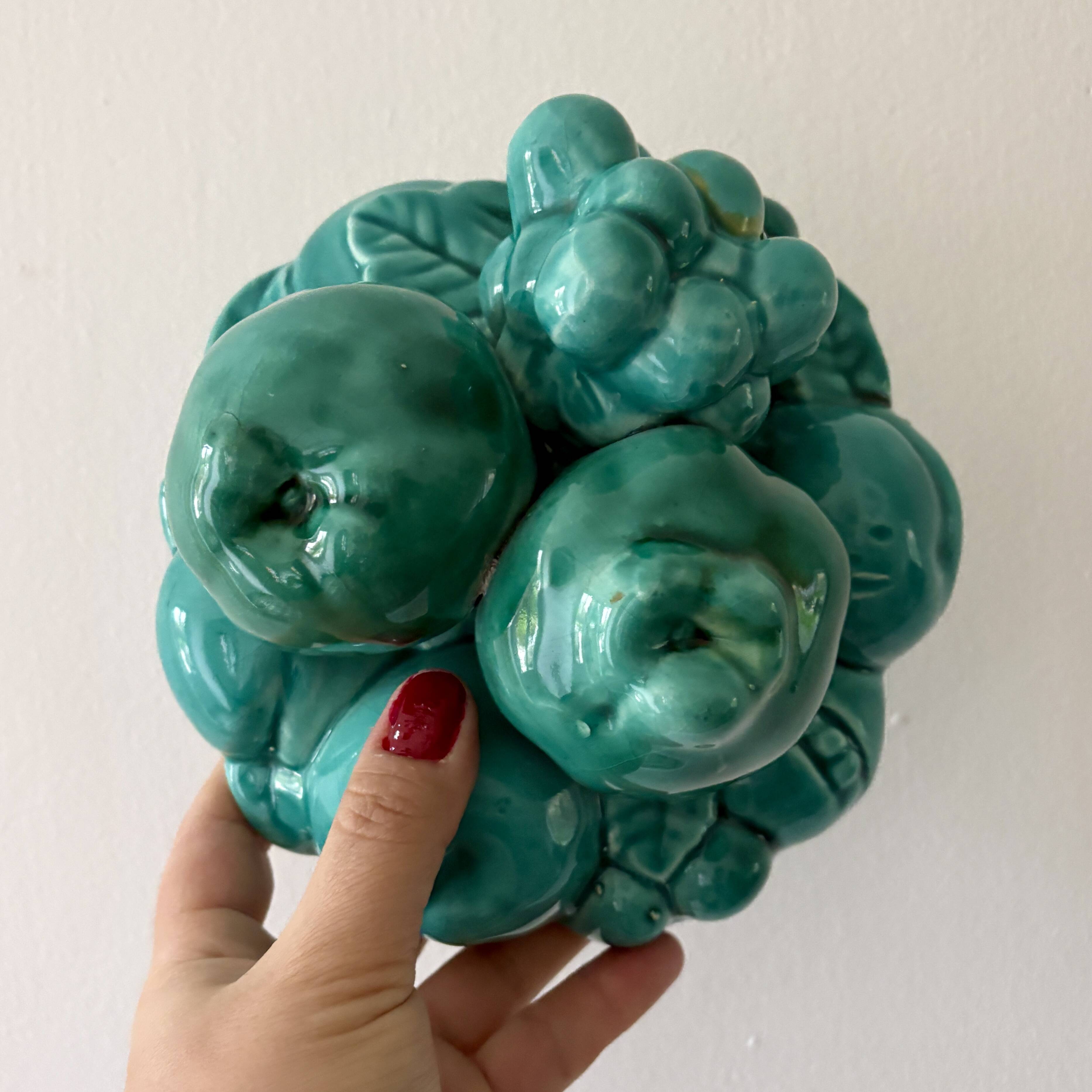 Vintage green earthenware plate/basket with fruit decorations.