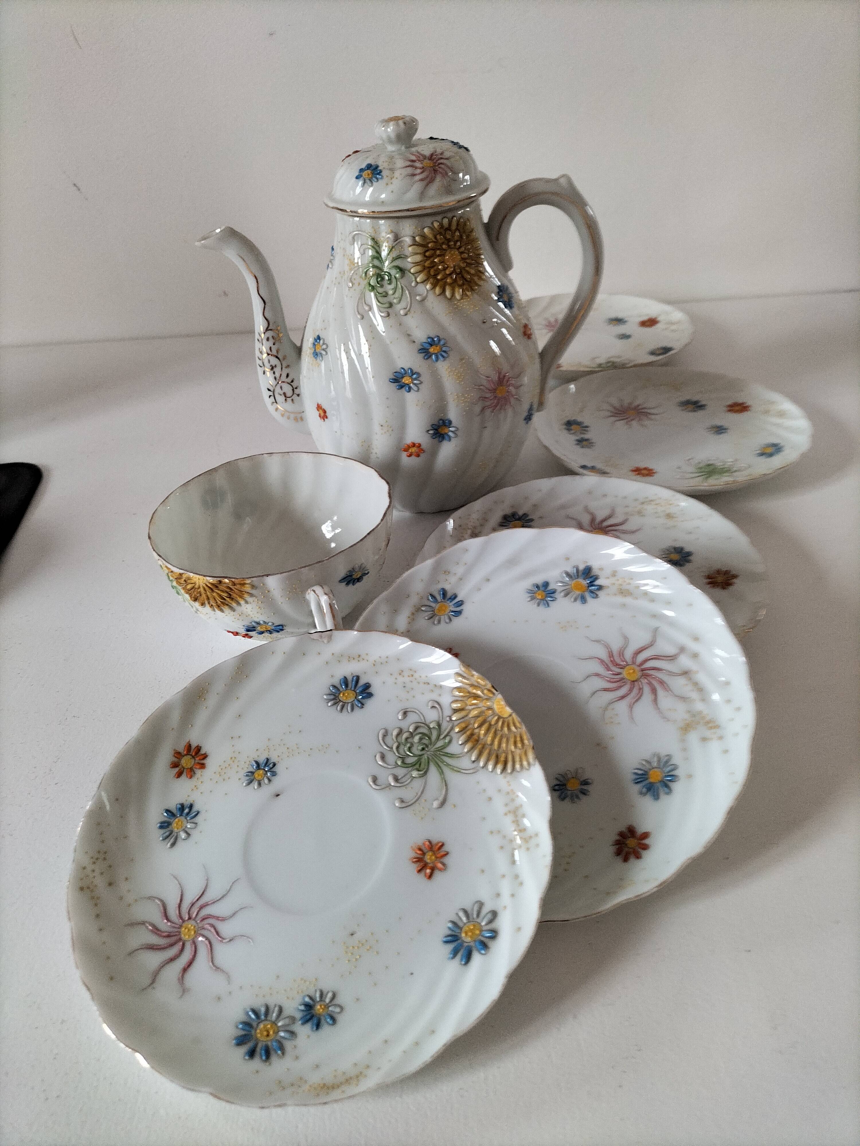 coffee pot, cup and saucers