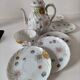 coffee pot, cup and saucers