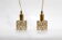 Two pendant lights in gilded brass and crystal, by Palwa, design 1960