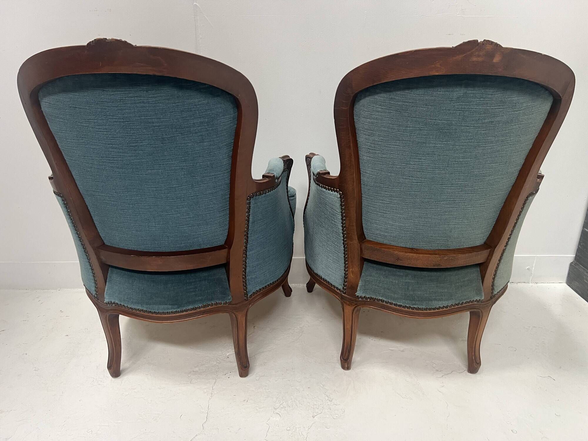 Pair of Louis XV style armchairs in natural wood, 20th century.
