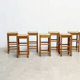 set of seven rattan and wood barstools