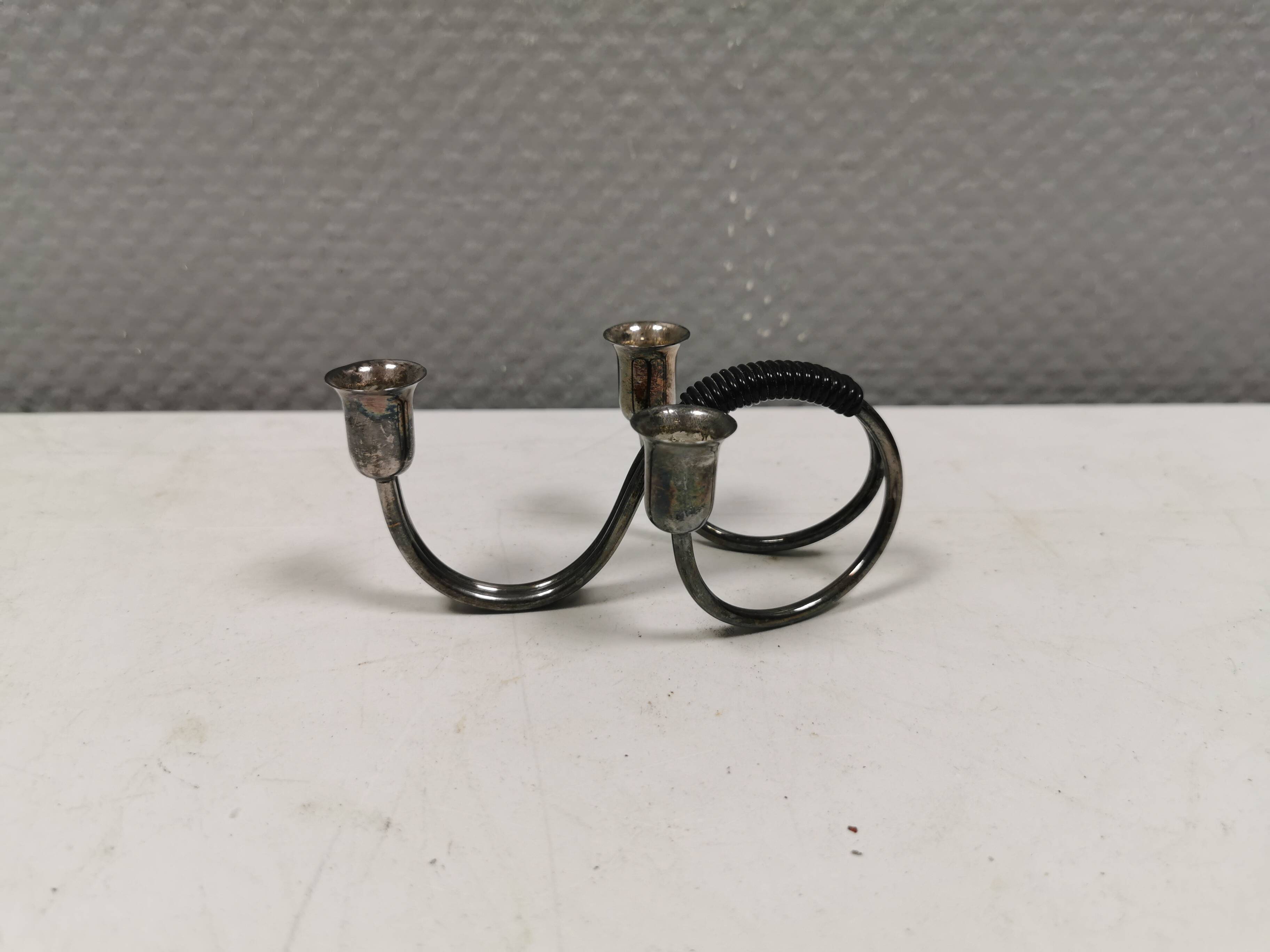 Small candle holder in tarnished silver, with place for three small candles