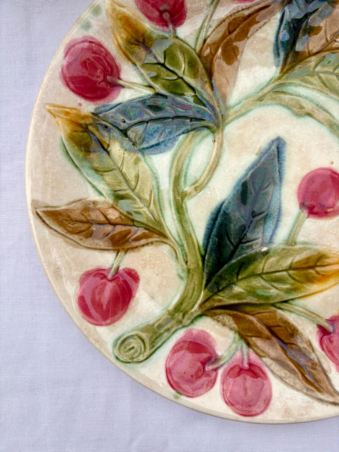 Very old barbotine plate with cherries