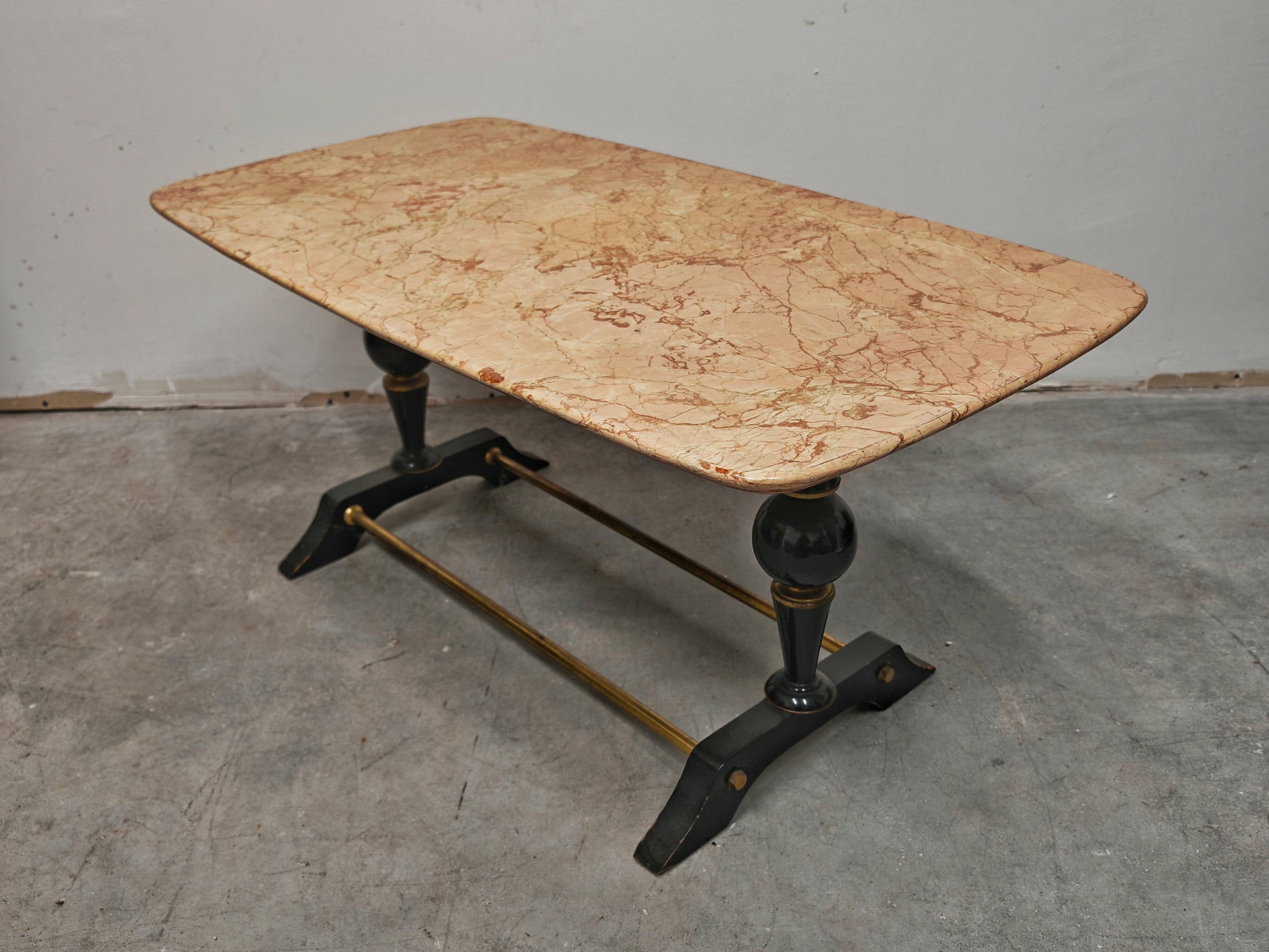 Mid-century modern coffee table in marble, brass, and wood, 1950s.
