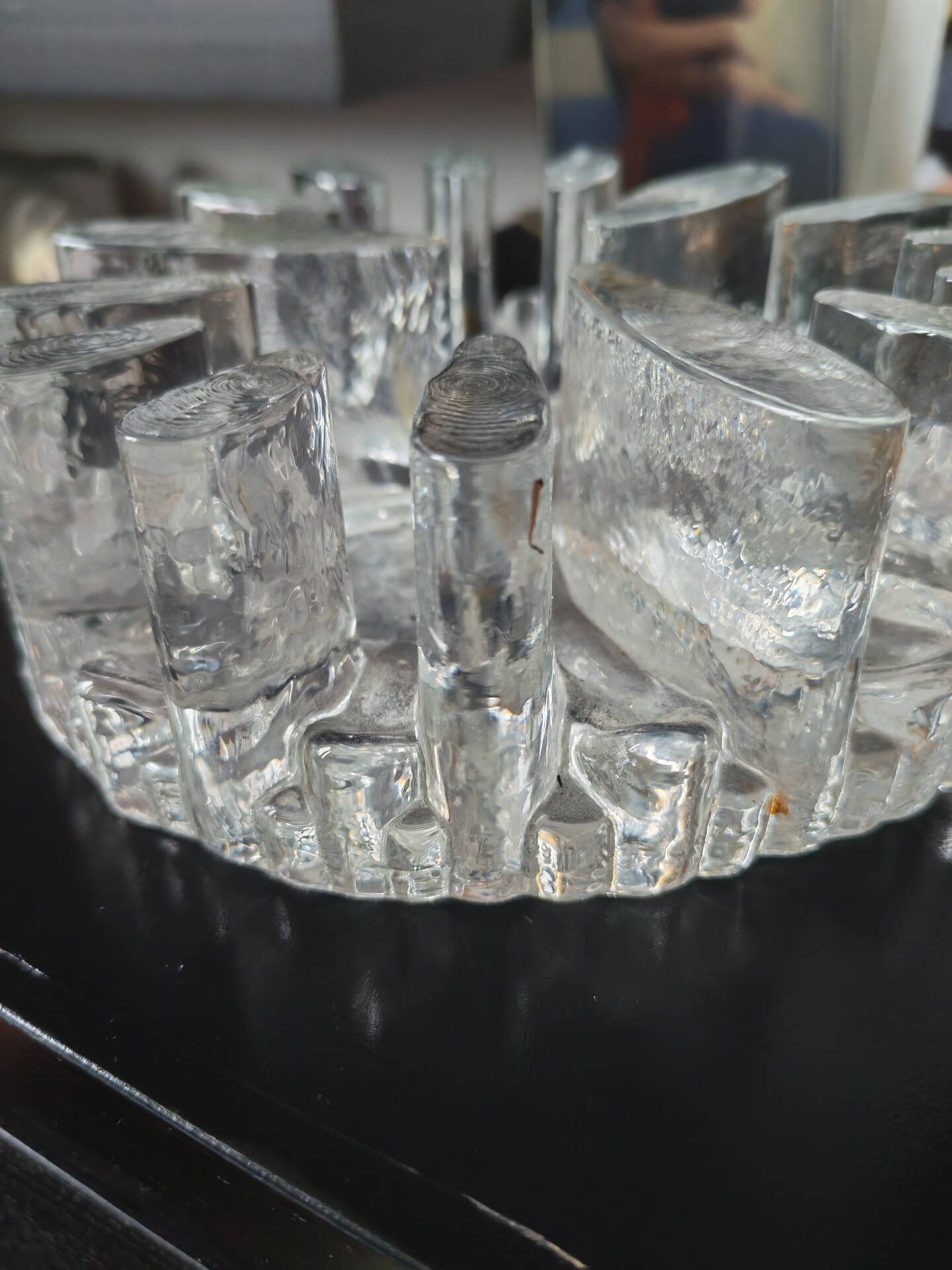 Large glass candle holder in iceberg brutalist style.