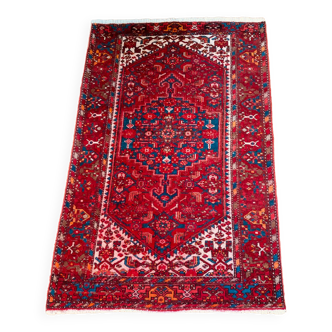 Handmade woolen oriental rug from the 20th century