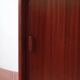 Teak enfilade, sliding doors, black faux leather top, 1970s.