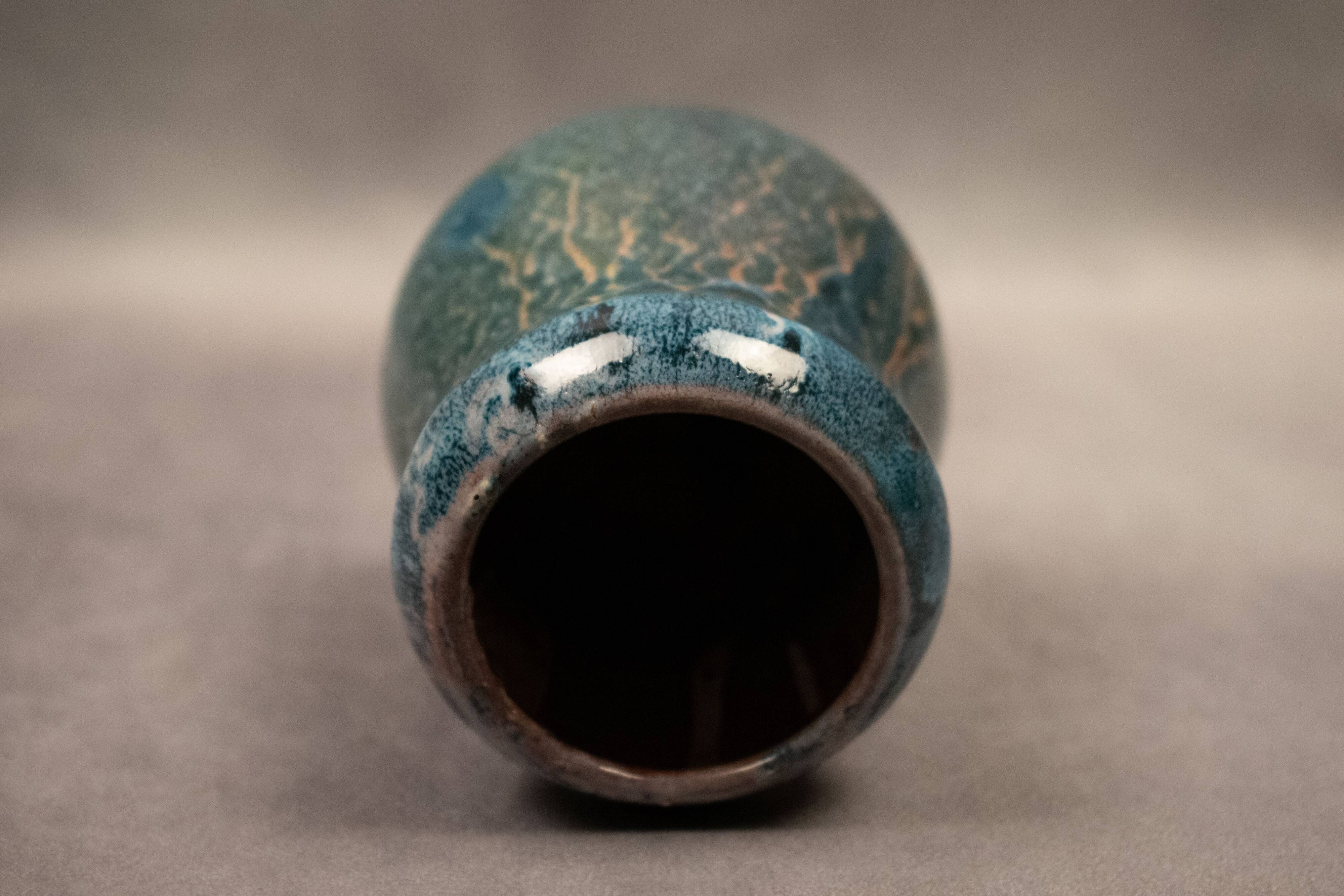 Small flamed stoneware vase in shades of blue and orange