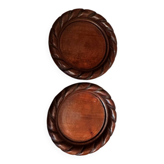 Pair of turned and carved wooden bottle coasters from the 1950s.