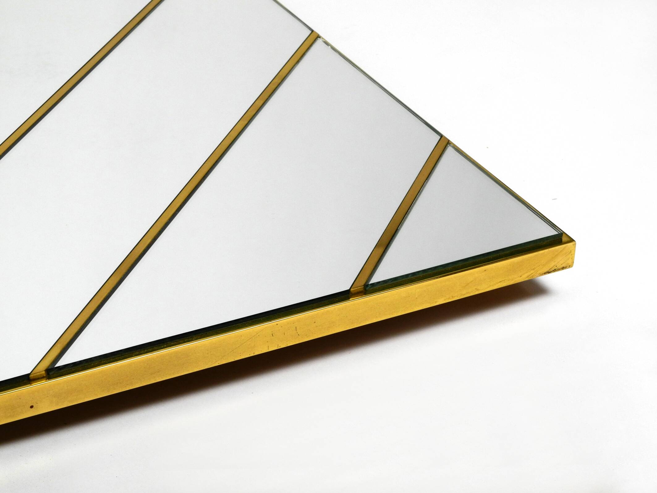 Large, exceptional 1970s brass wall mirror with diagonal mirror strips