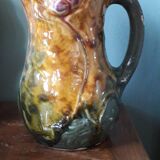 Vintage barbotine pitcher with floral decoration