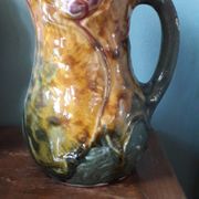 Vintage barbotine pitcher with floral decoration