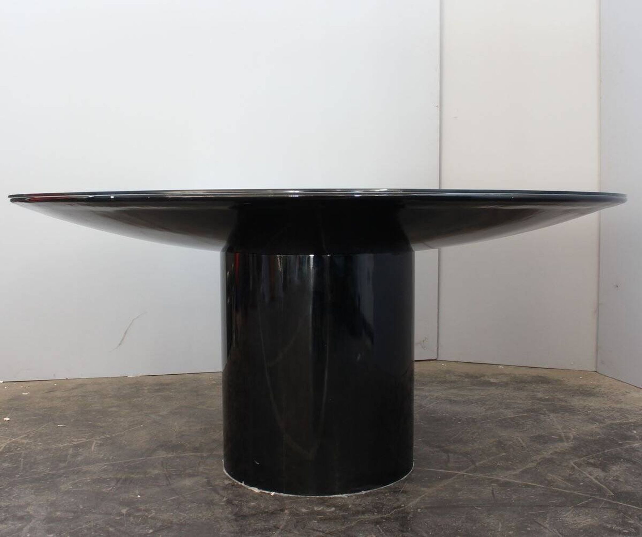 Black lacquered glass table and glass in the hoof style, Italy.