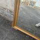 Large antique gilded mirror with carved pediment, 126 cm