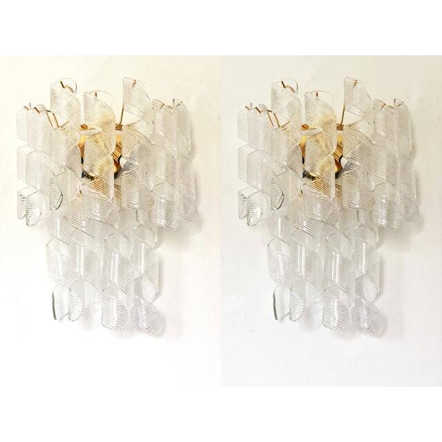 A pair of contemporary transparent “ricci” murano glass wall sconces