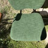 50s chair with armrests.