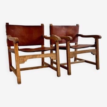 Pair of brutalist design armchairs, leather and wood, Spain 1960