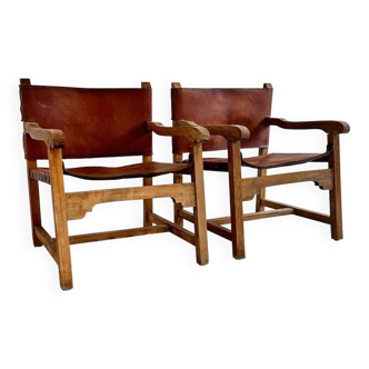 Pair of brutalist design armchairs, leather and wood, Spain 1960