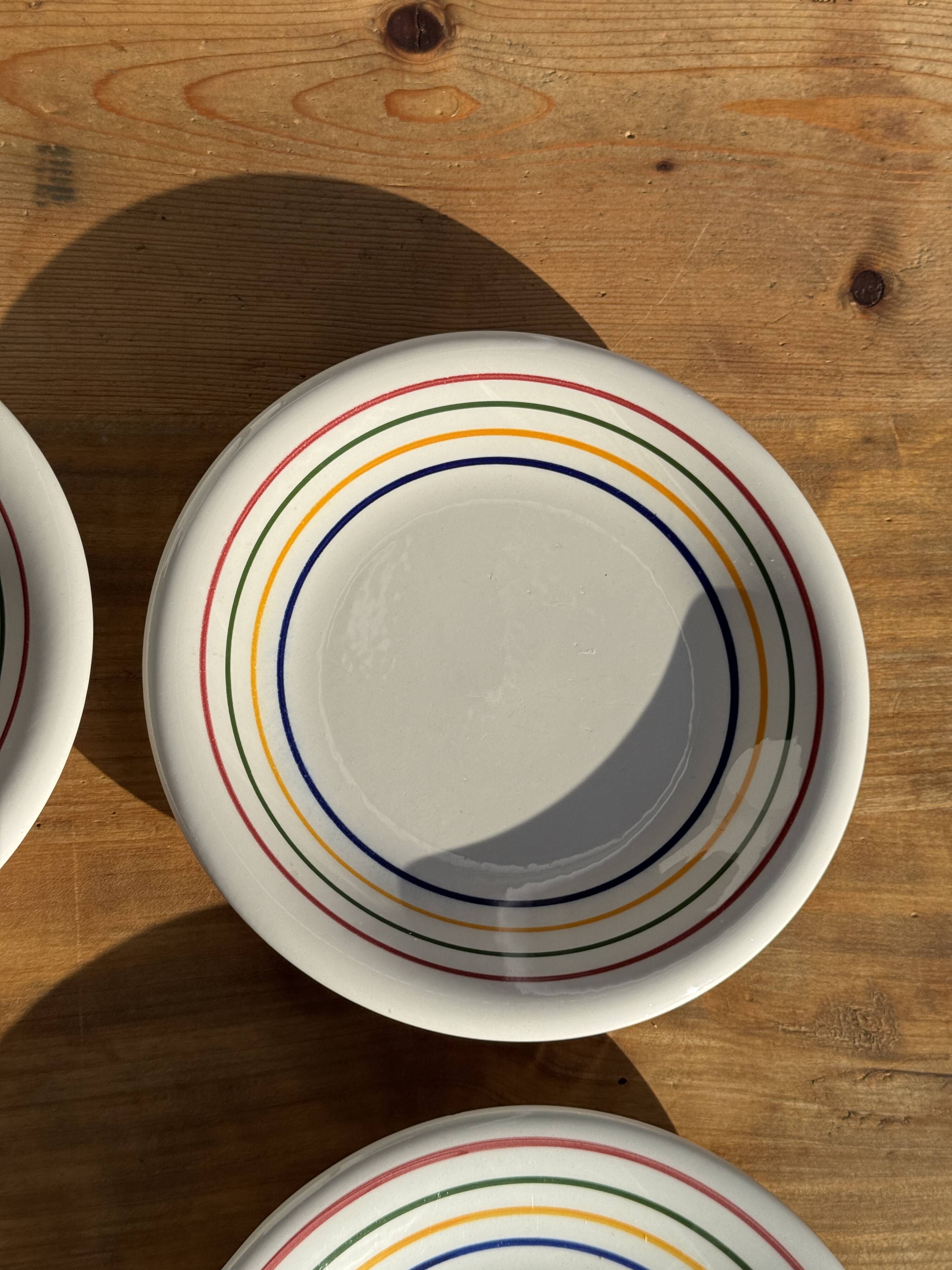 Set of 9 small Italian dessert plates Primula with red and green trim.