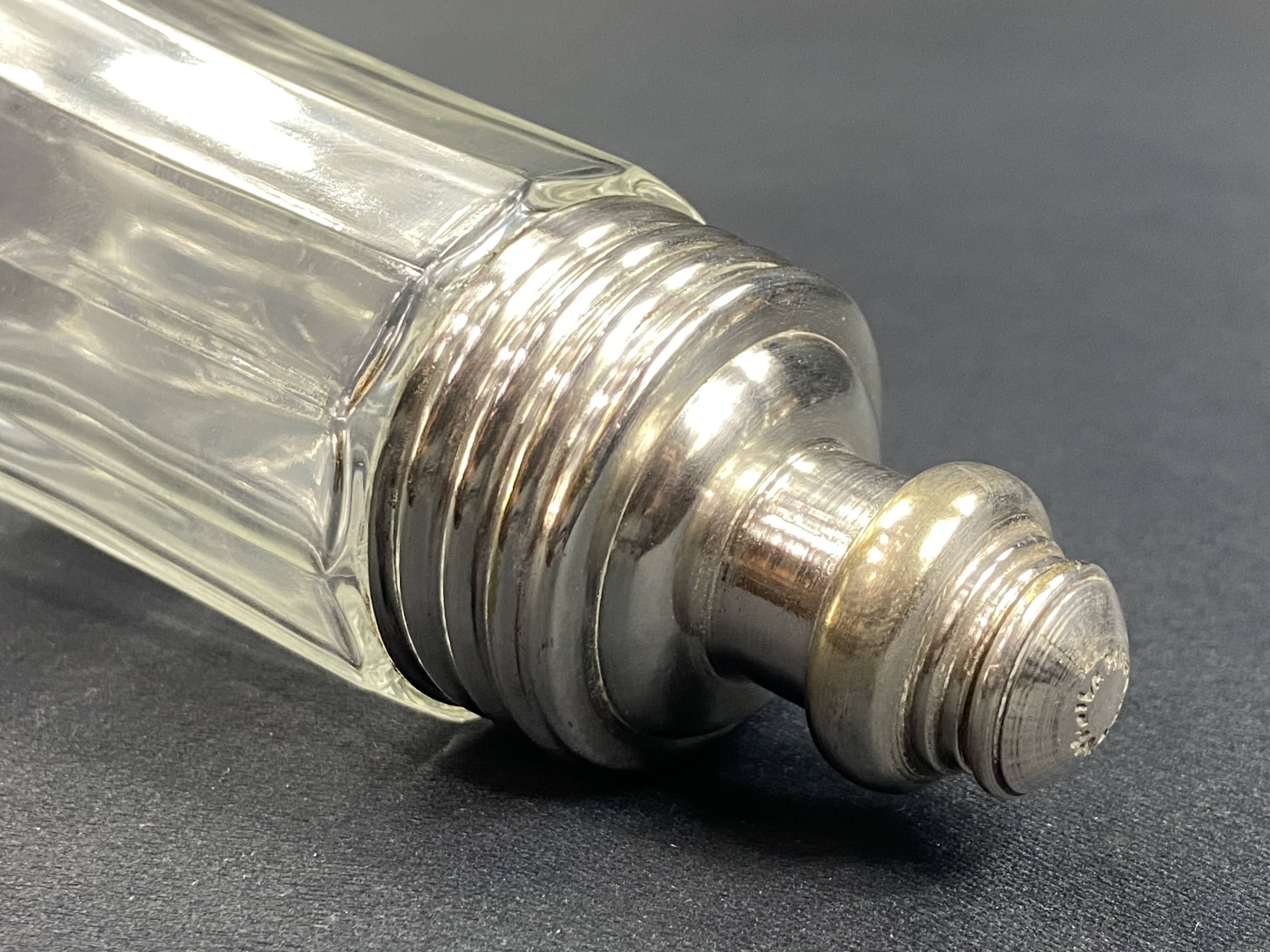 Glass and silver metal sugar shaker