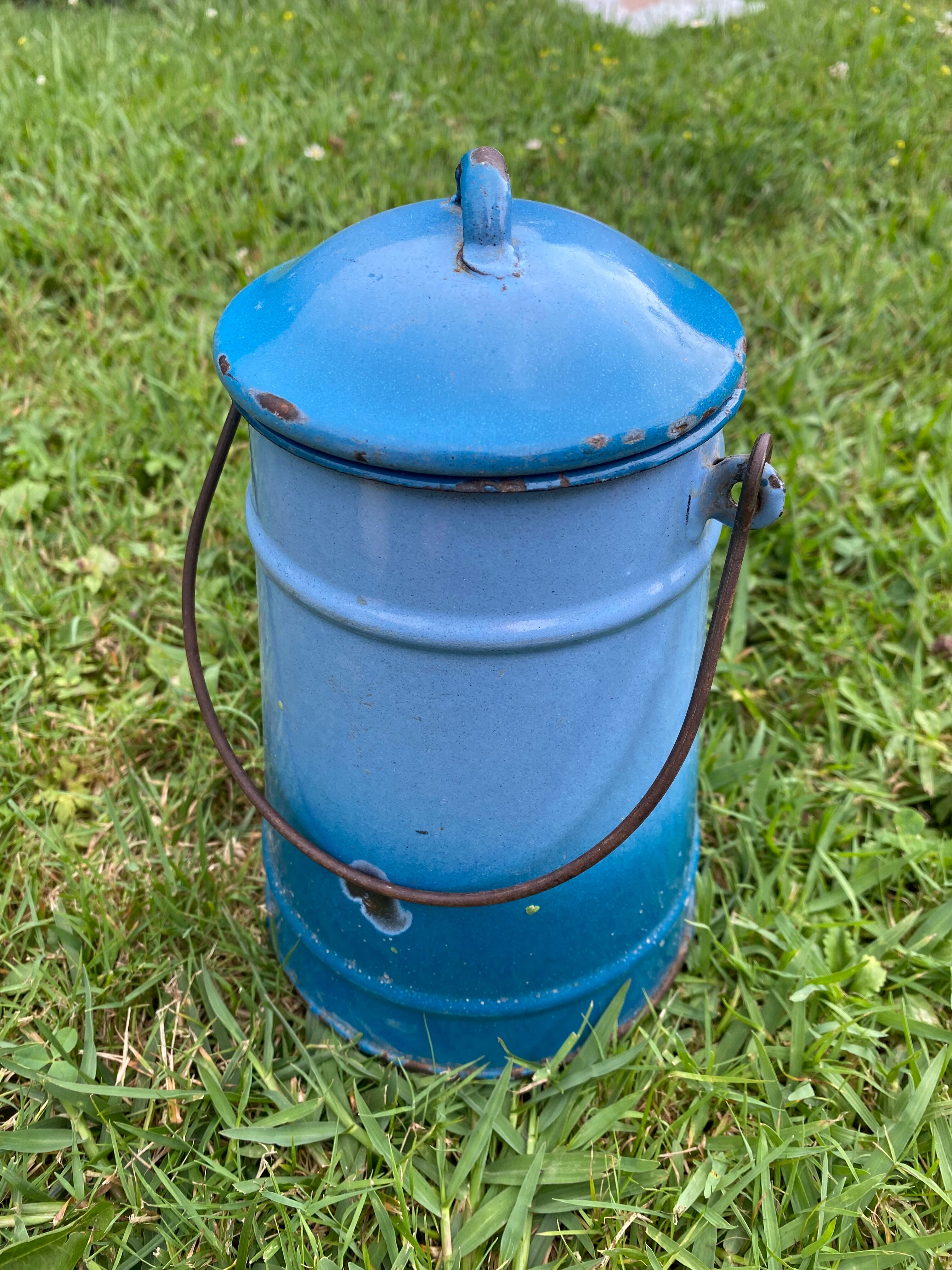 Old milk pot in enamelled sheet metal