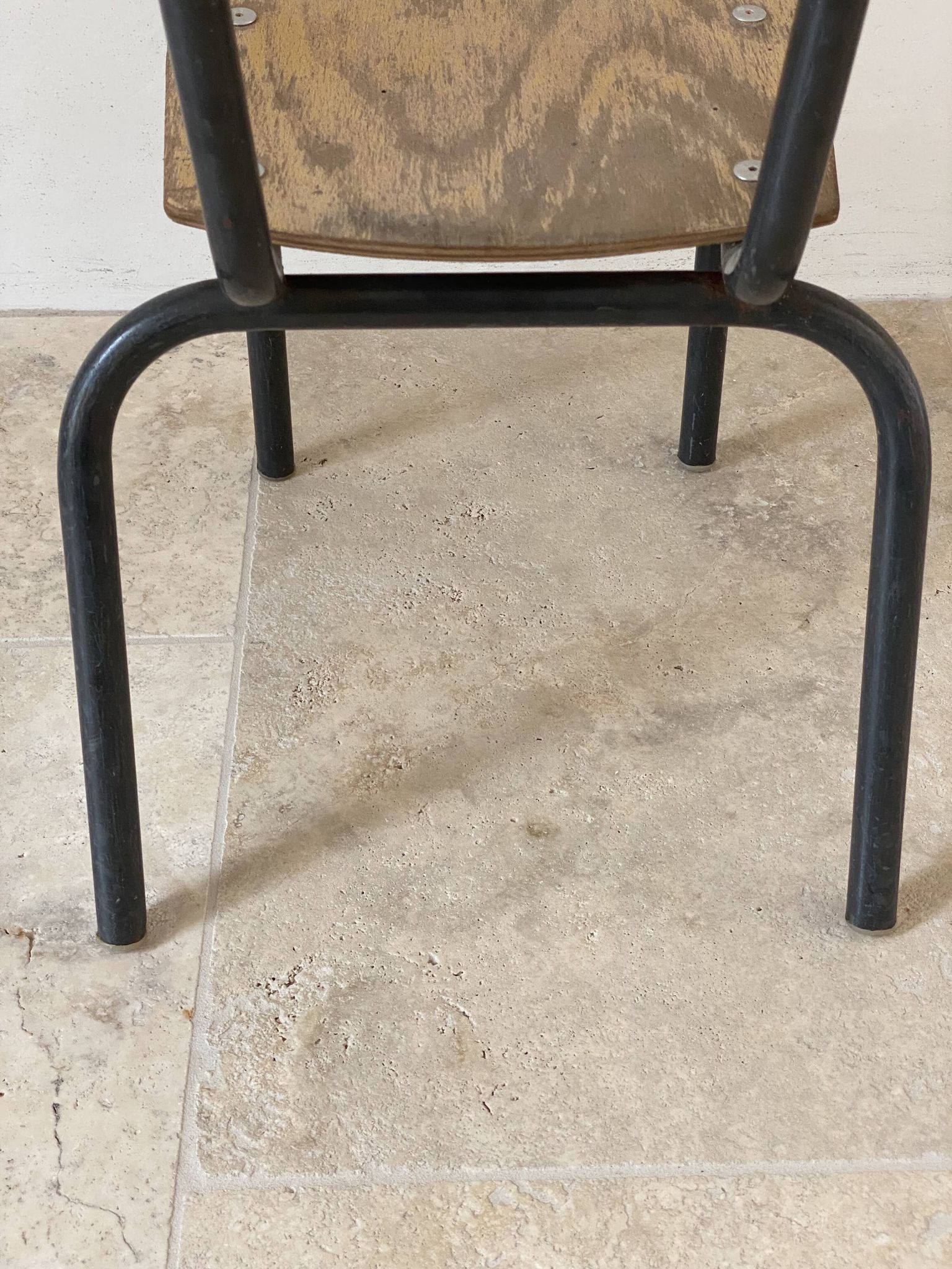 Vintage children's school chair in wood and black metal, industrial style.