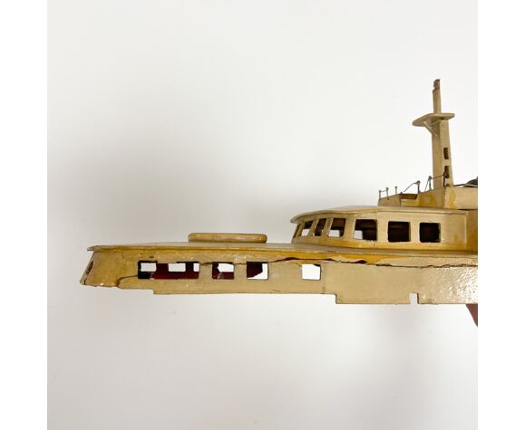 Vintage painted wooden model boat with motor