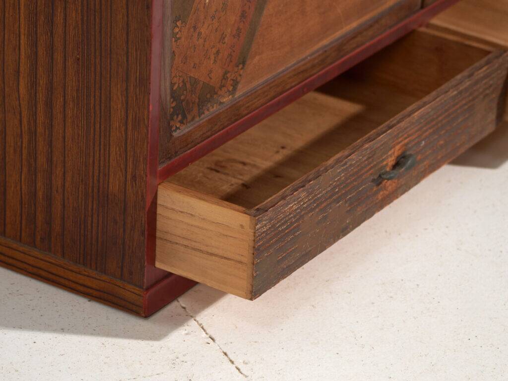 Small Japanese cabinet with sliding doors, Kabuki decoration, made of paulownia wood, early Showa period, circa 1926–1970.