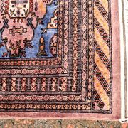 Oriental rug, size 243 x 168 cm, signed and numbered.