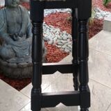 Black bar stool and skin of cattle.