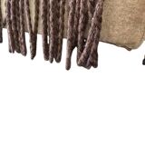 Vintage beige two-seater canapé with fringes.