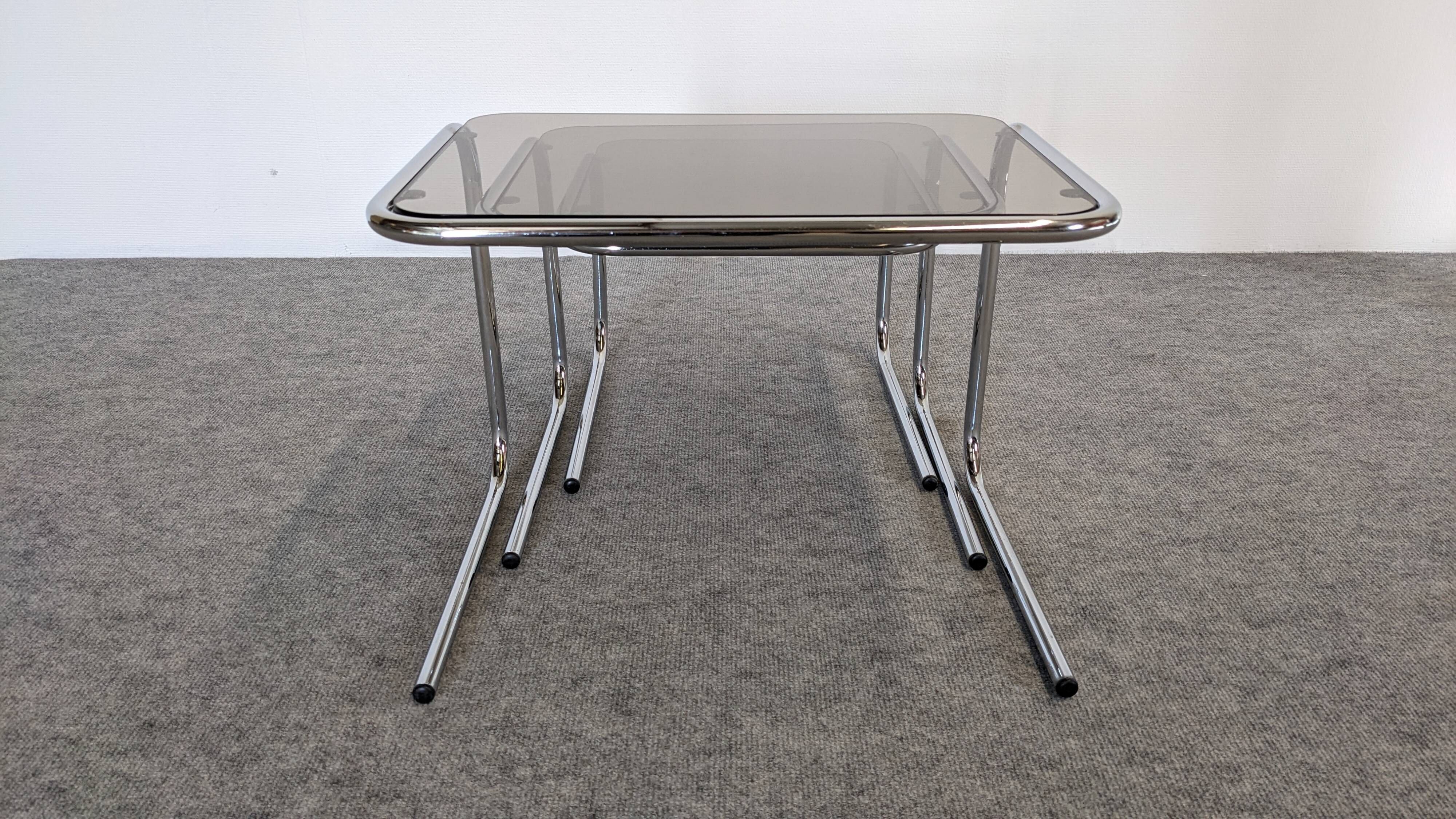 Nested tables with tubular chrome and smoked glass, France 1970.