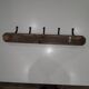 Vintage wooden coat rack with 5 double cast iron hooks