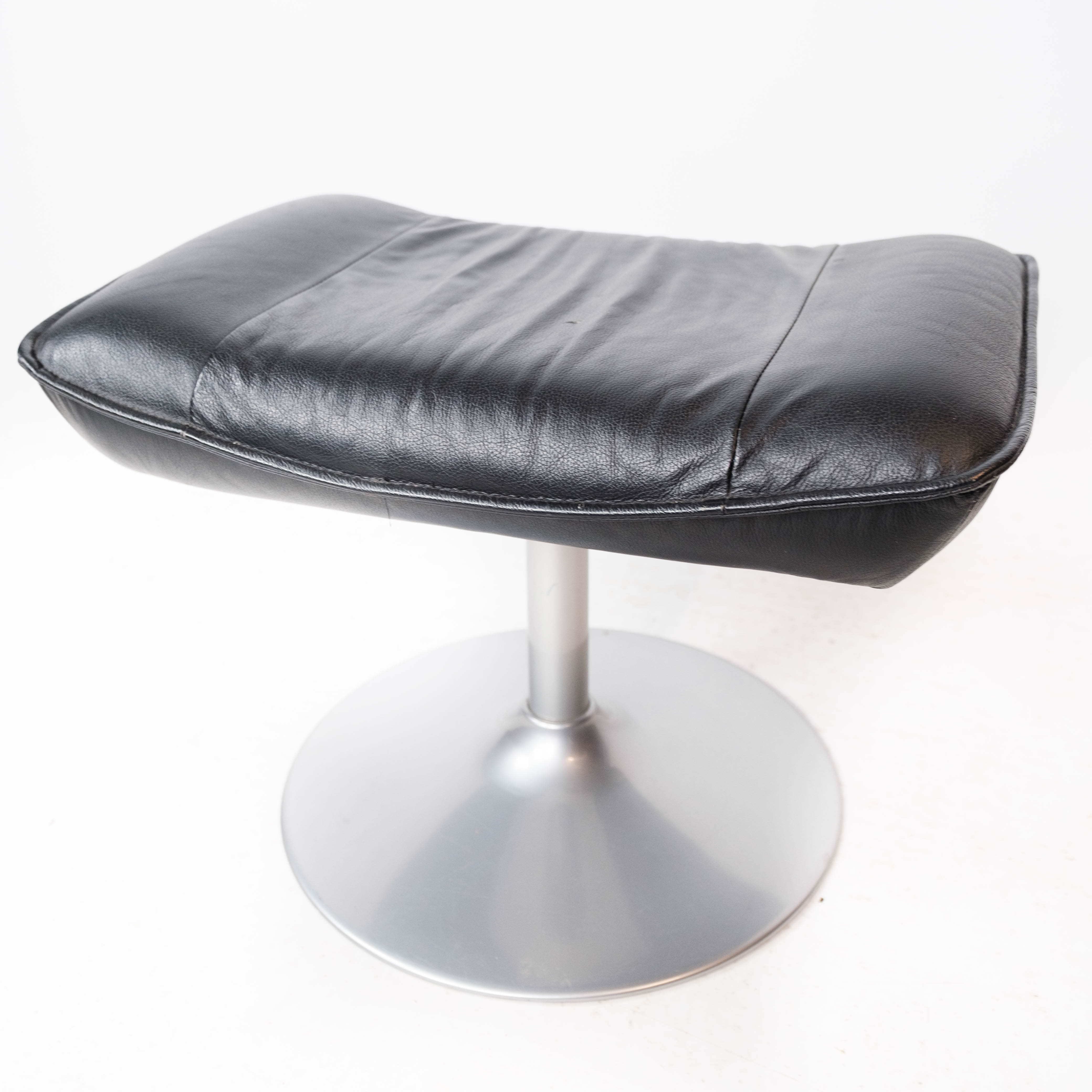Easy chair with stool upholstered with black leather of Danish design, 1970s