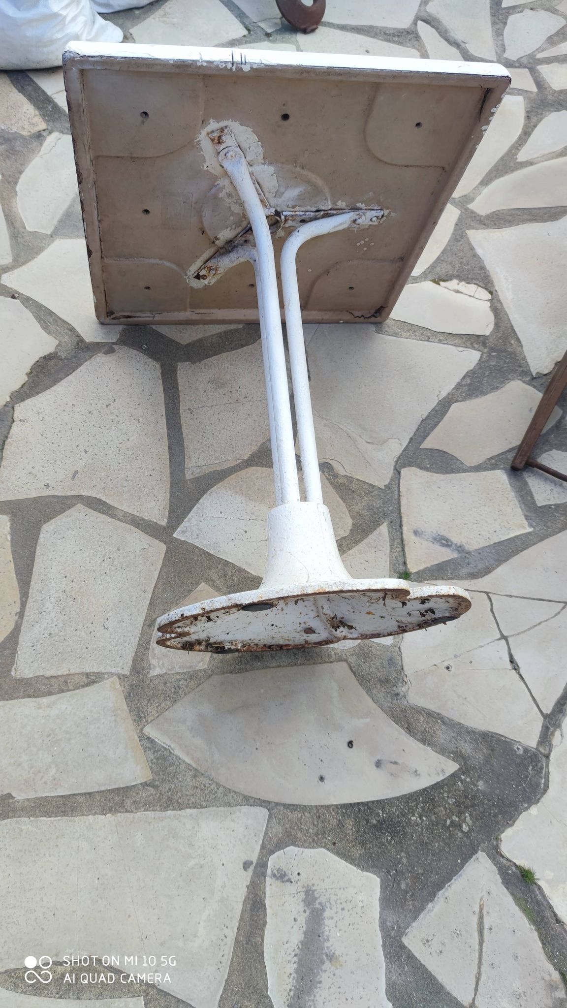 Garden or bistro table with steel and fiberglass base and top, circa 1970