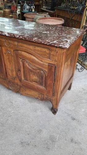 Very Louis XV from the 18th century in walnut with a marble top.