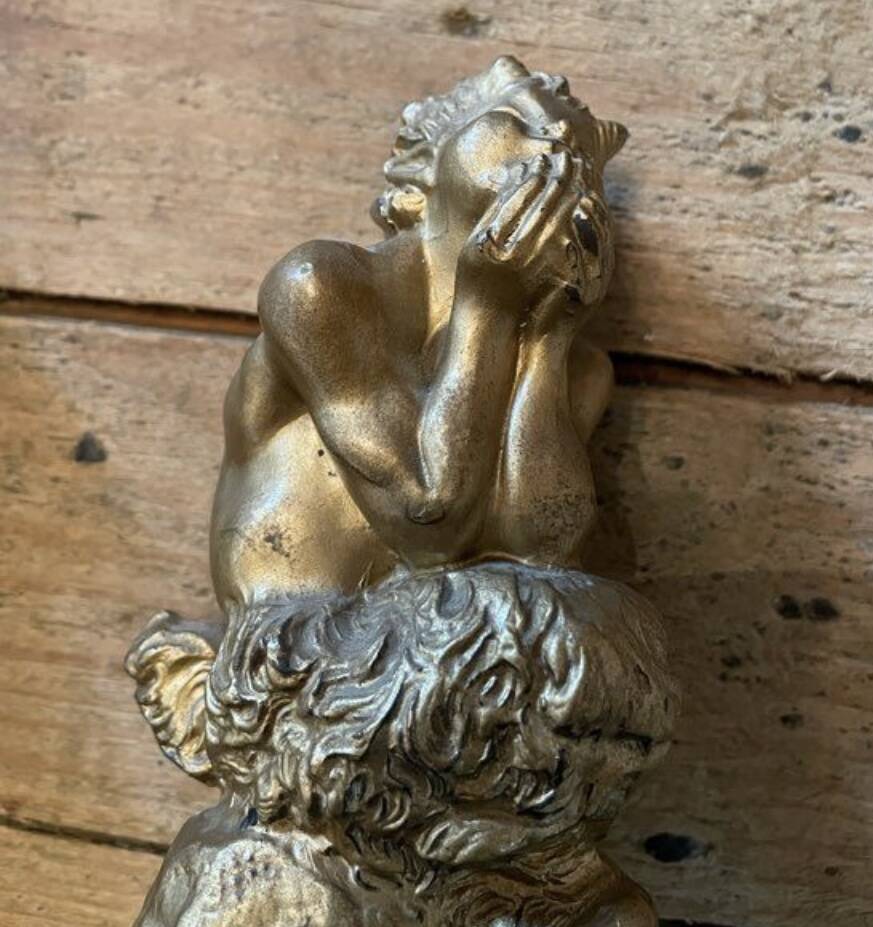 2 Seated satyr sculptures in cast bronze