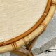 Round coffee table in vintage rattan