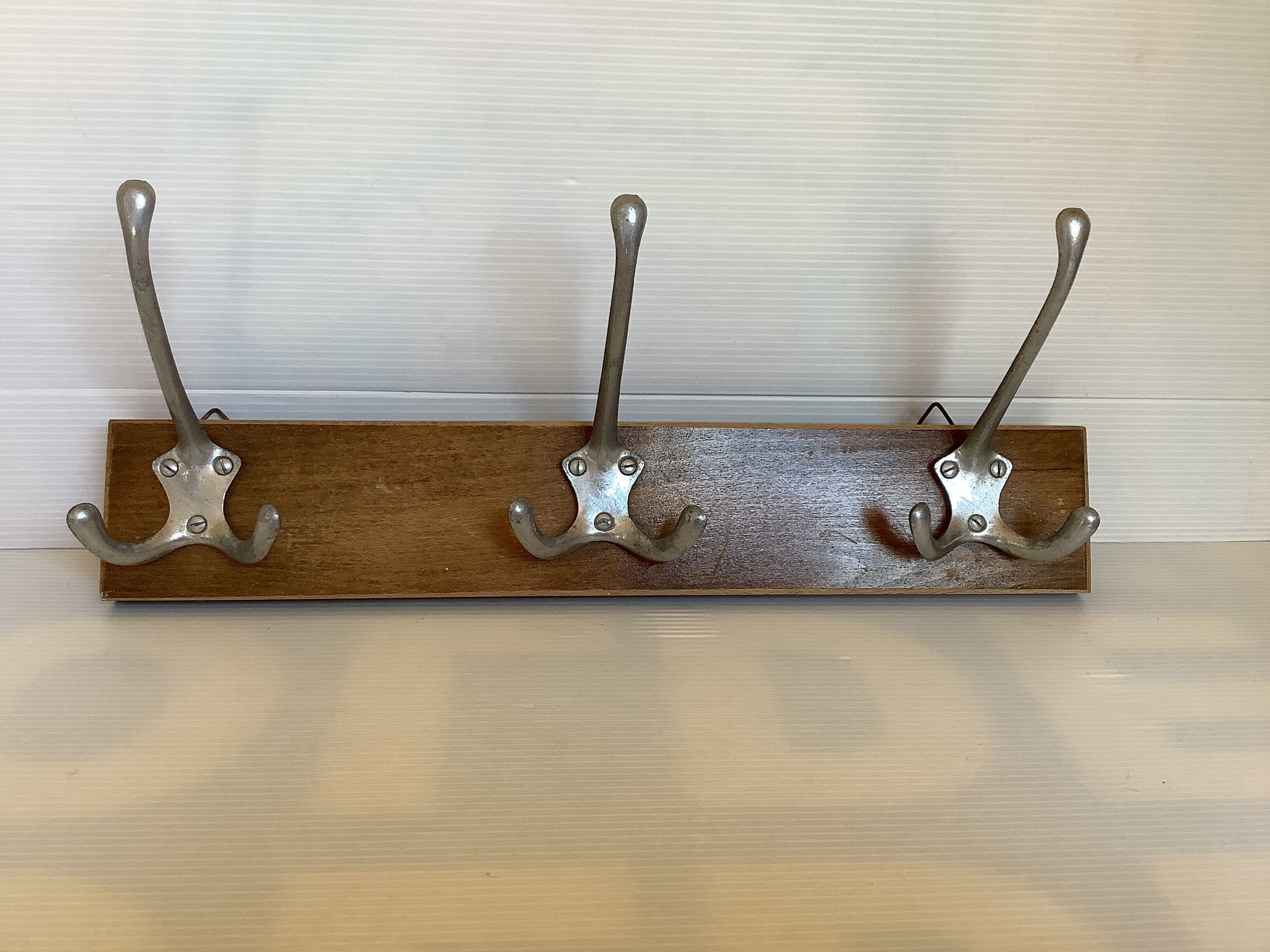 Old coat rack wood metal three hooks