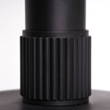 Matte black metal lamp signed by hand by its creator Marc Held