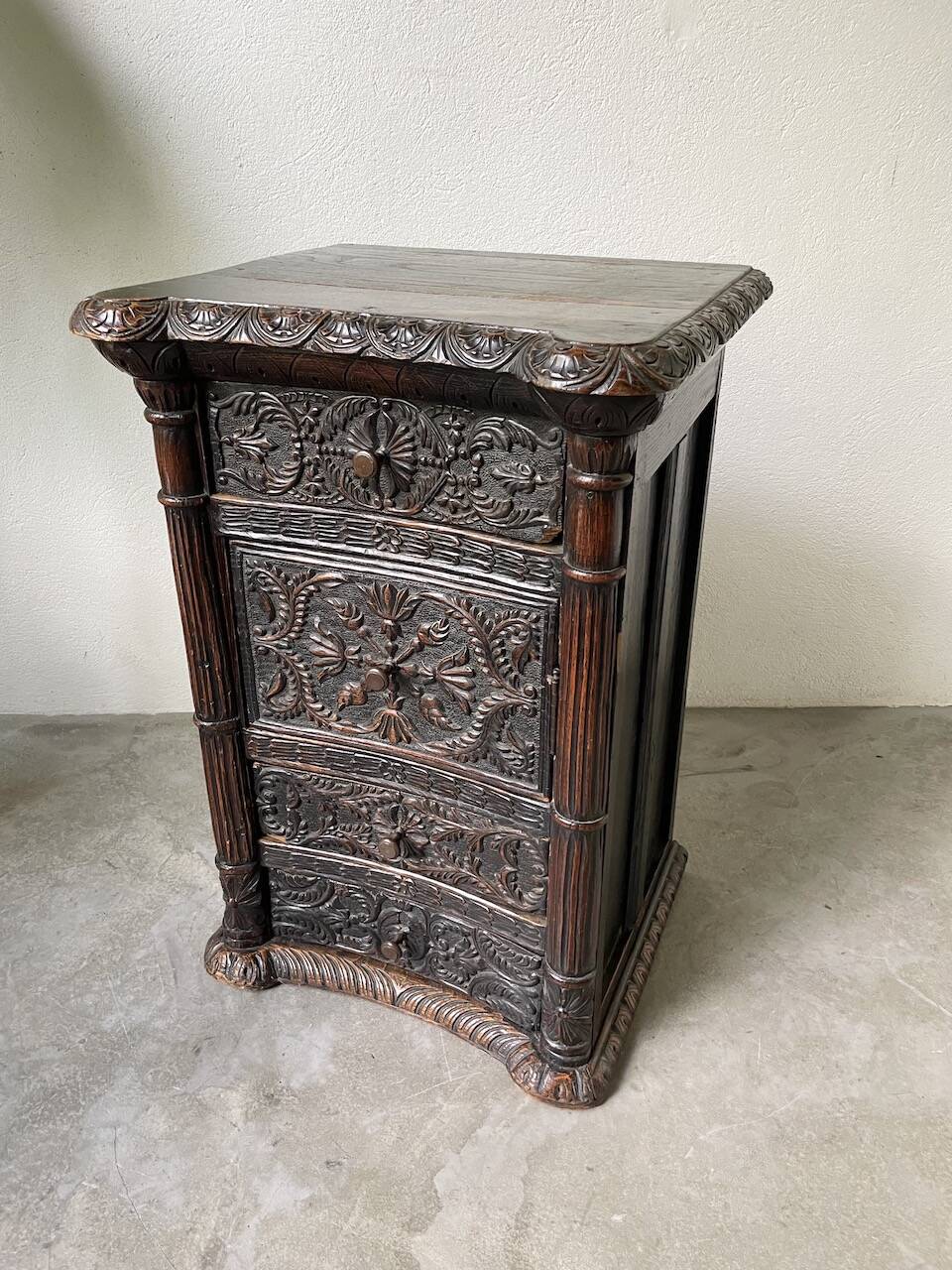 19th century chest of drawers in carved blackened pine