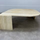 Table basse travertin forme œil par Roche Bobois