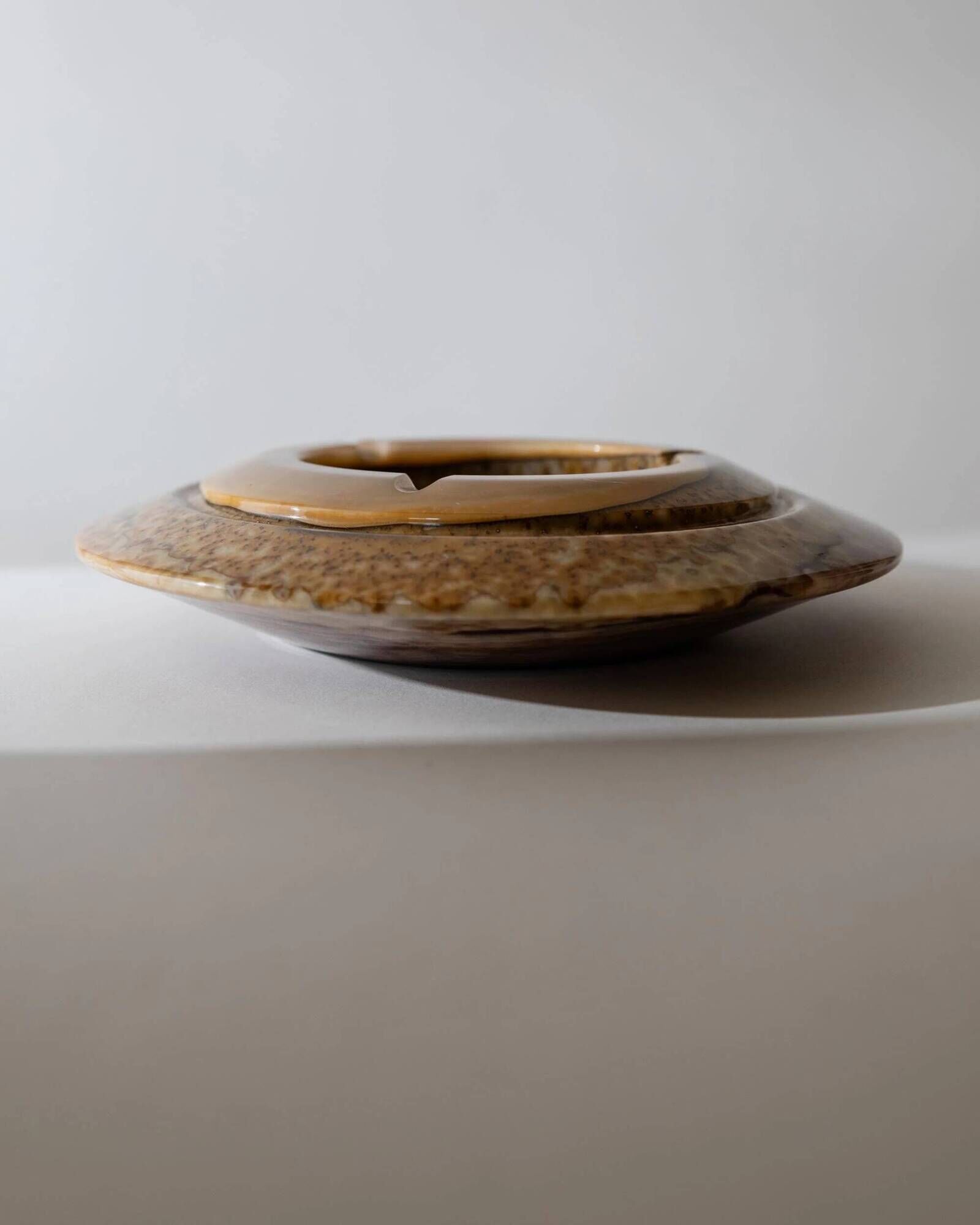 Vintage onyx ashtray from the 1980s, large round, brutalist design, brown and beige tones, sculptural table accent, modernist object, elegant gift idea.