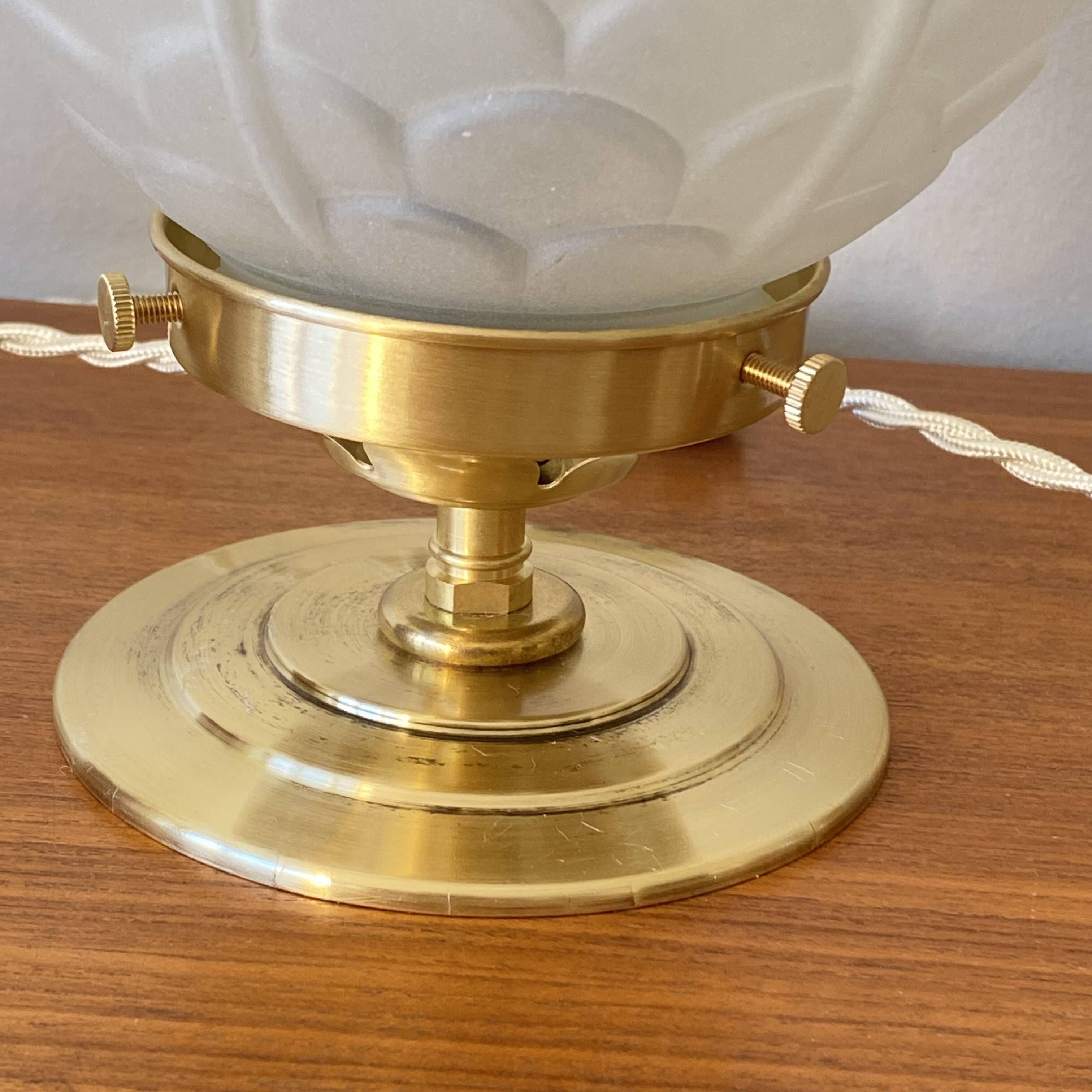Pair of Art Deco glass globe table lamps with brass base.