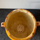Old grease pot in glazed yellow terracotta, France nineteenth century